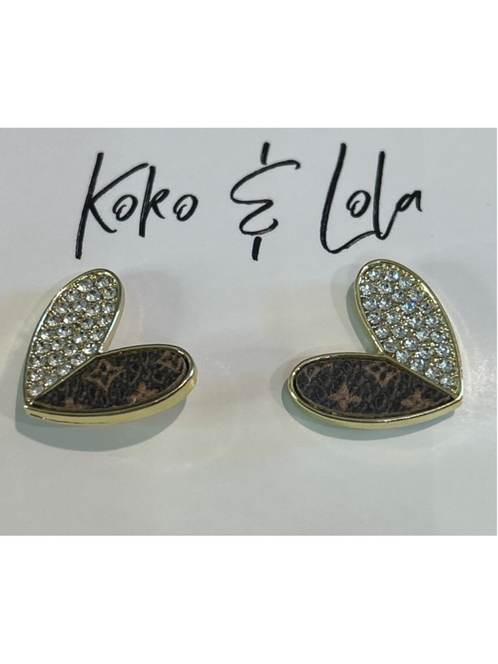 Women's Koko & Lola earrings feature a designer-inspired heart pattern w/crystal